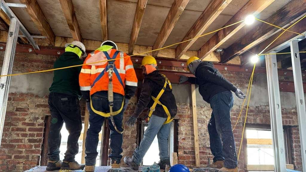 A S Builders crew installing structural steel